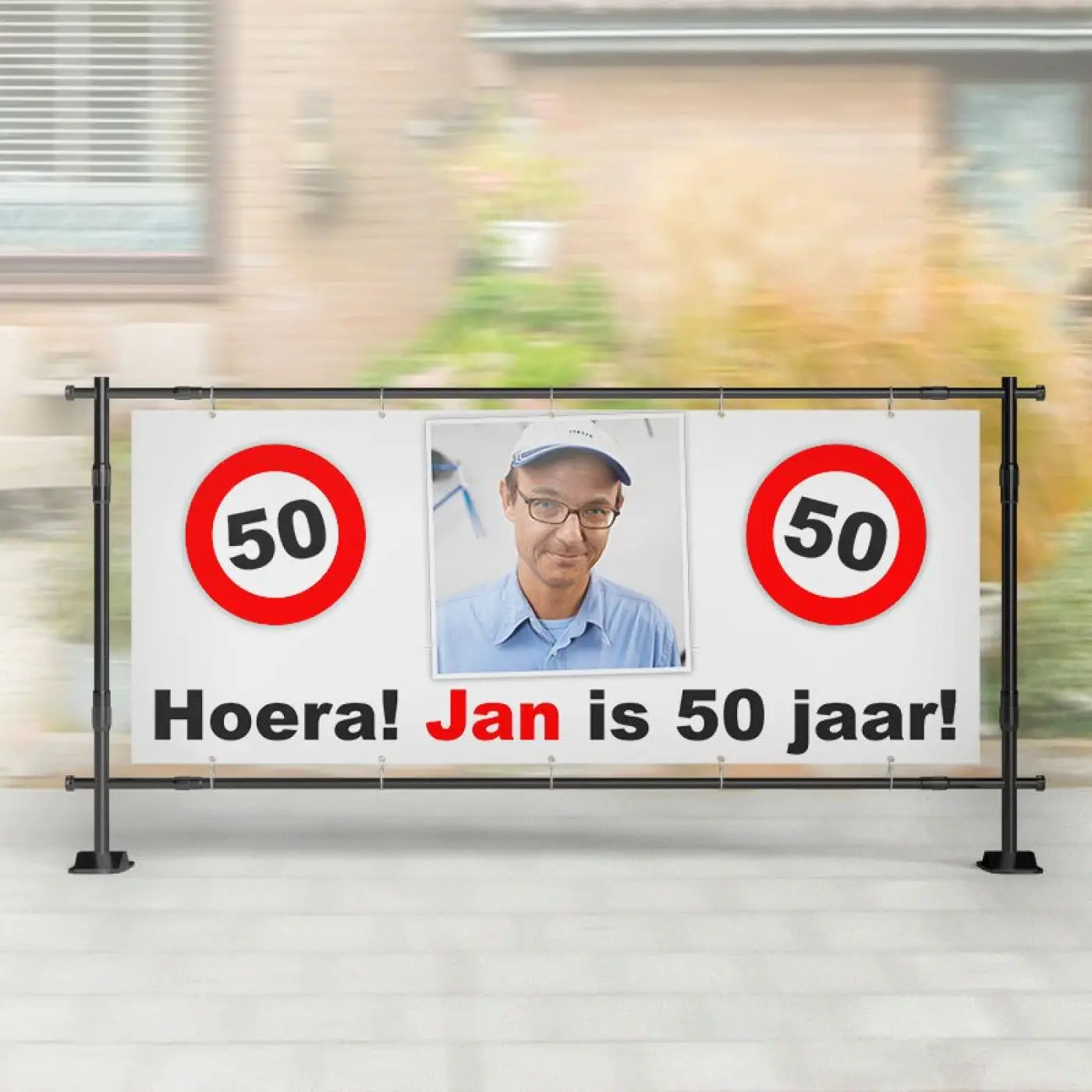 Witte spandoek abraham met rood verkeersborden 50 en foto van man tekst hoera jan is 50 jaar